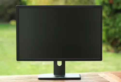 PSD monitor mockup on a wooden table