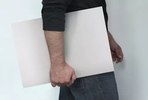 A person folding PSD Mockup Sheet