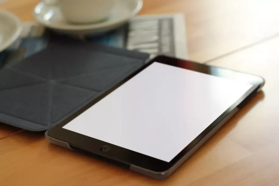 Tablet on the table PSD mockup