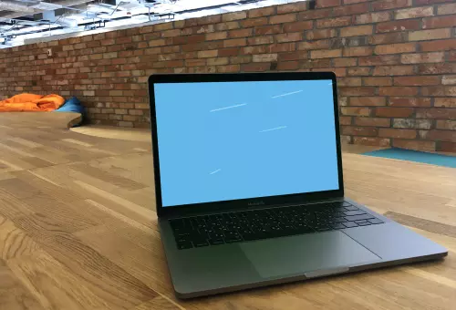 Macbook Pro mockup on wooden table