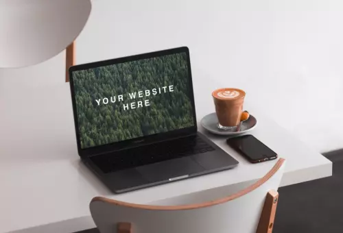 Macbook Pro PSD mockup on white table