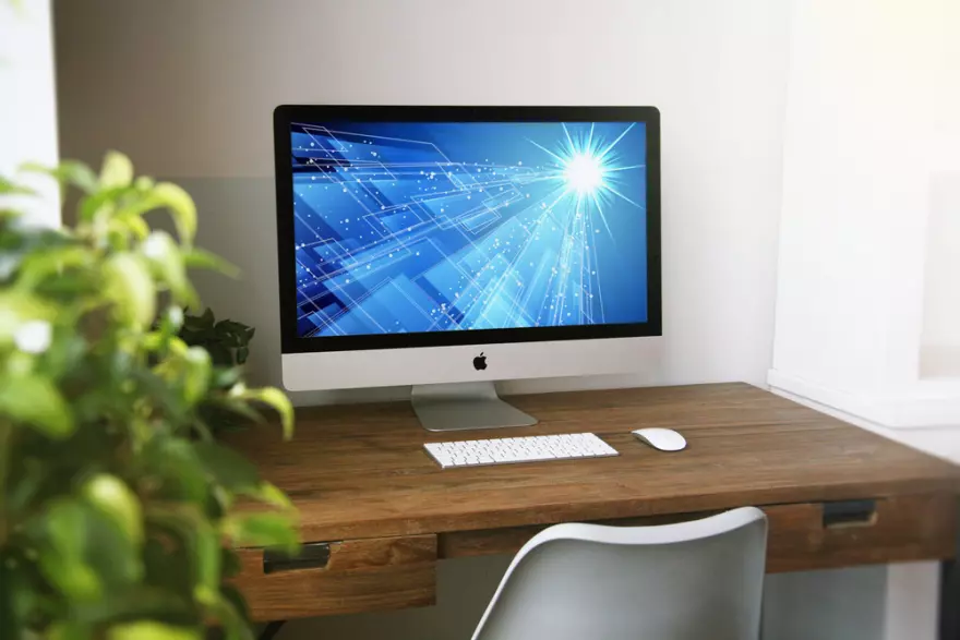 Download iMac on a table in a room