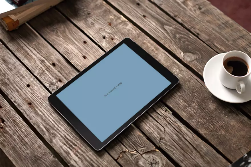 Download Tablet next to a cup of coffee PSD mockup