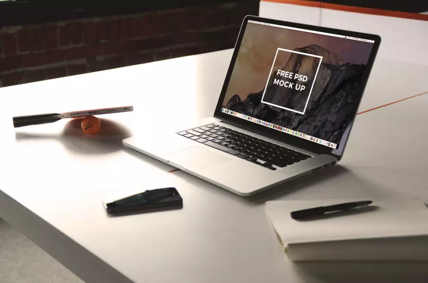 Download MacBook on the table (PSD mockup)