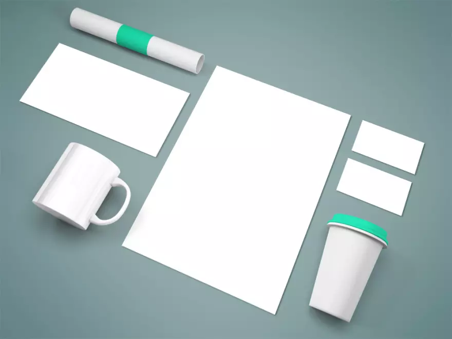 Download Brand identity elements with a mug PSD mockup