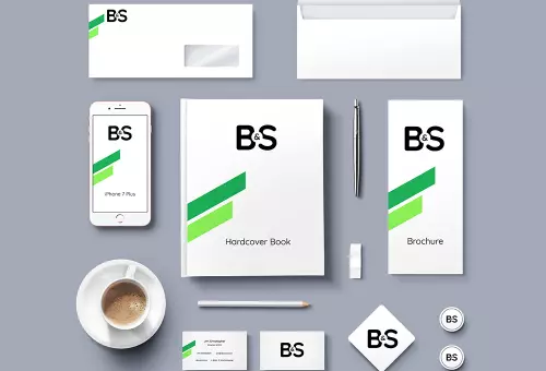 Brand identity elements with a cup of coffee PSD mockup