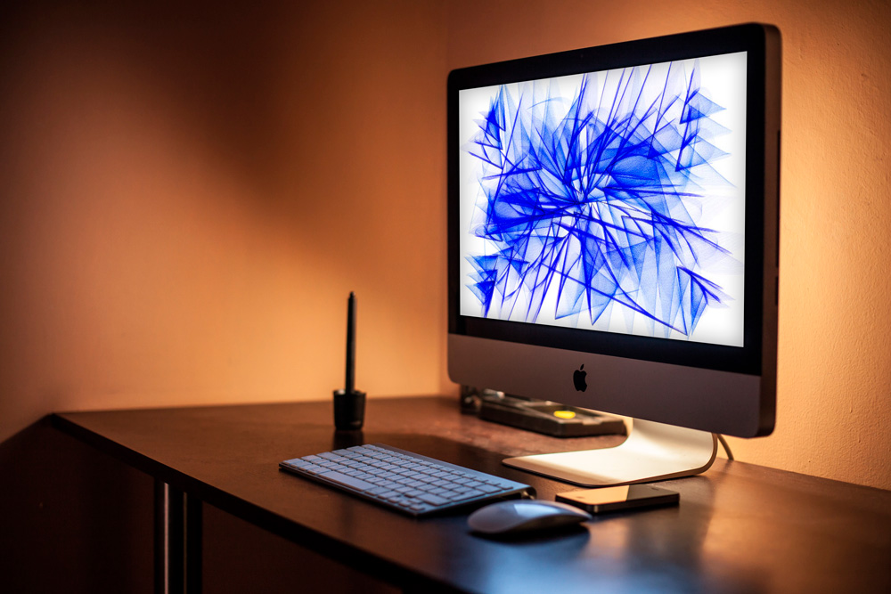 iMac on wooden table PSD mockup